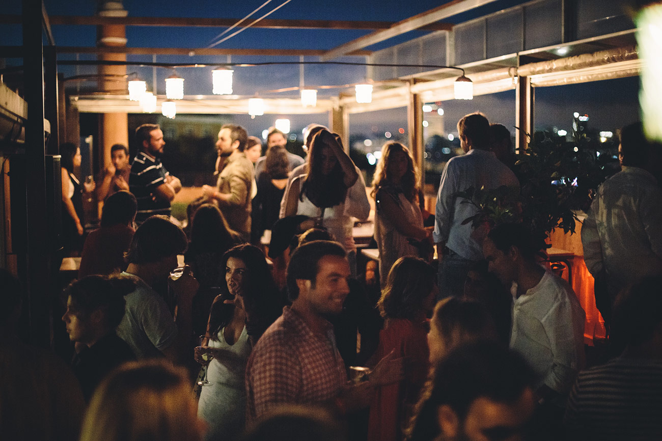 Group of people at a party, in The Insólito rooftop